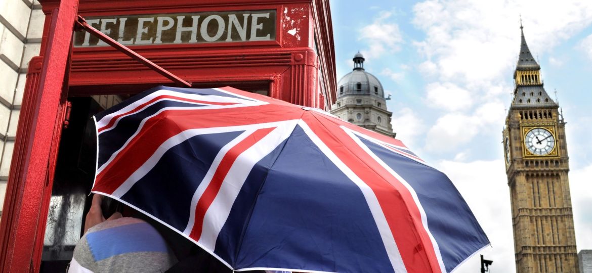 Tourist in telephone box and Big Ben in London